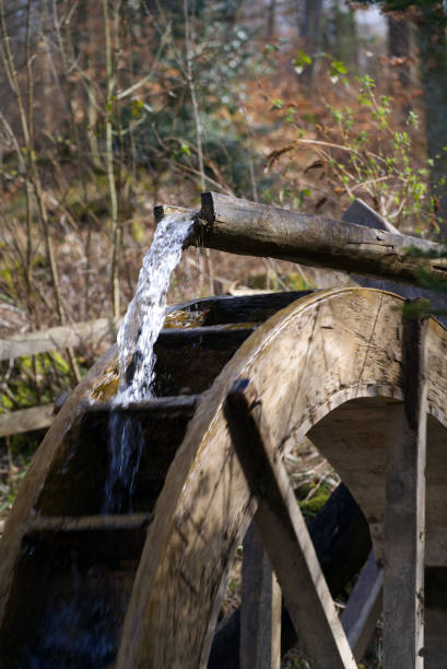 istock Water wheel in the forest at springtime. 1309443749