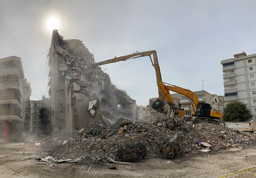 Miami Beach, United States - November 13, 2022: Excavators quickly remove debris from the imploded demolition of Miami Beach's famed Deauville Beach Resort hotel. In this hotel, built in 1957, the Beatles performed in 1964 and they had US presidents such as JFK and Ronald Reagan as guests.