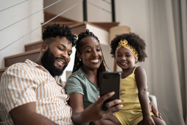 istock Family doing a video call on smartphone at home 1309450114