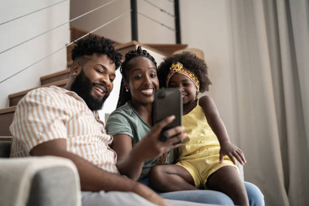 istock Family doing a video call on smartphone at home 1309450134