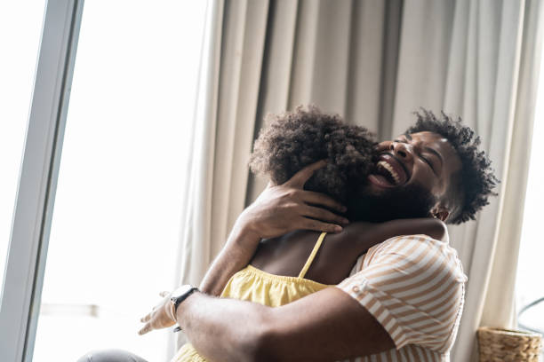 istock Father embracing daughter at home 1309450148