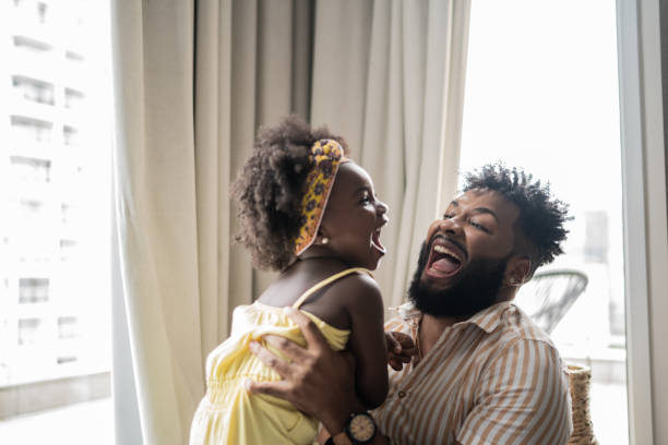 istock Father and daughter playing at home 1309450190