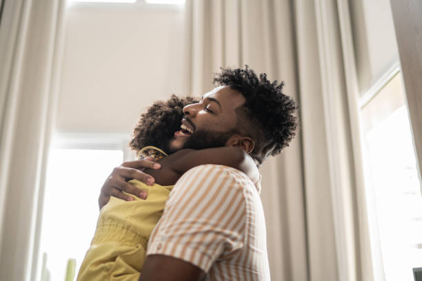 istock Father embracing daughter at home 1309450238