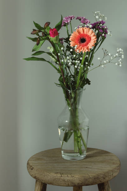 istock Vertical still life with a mix of spring flowers. 1309450552