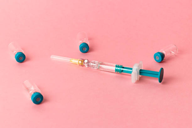 istock Syringe with several medical vials for injection. 1309451734