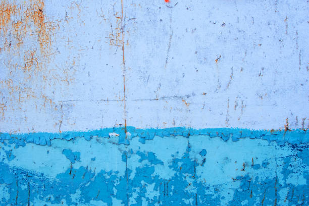 istock Abstract weathered blue metal cracked surface background 1309455076