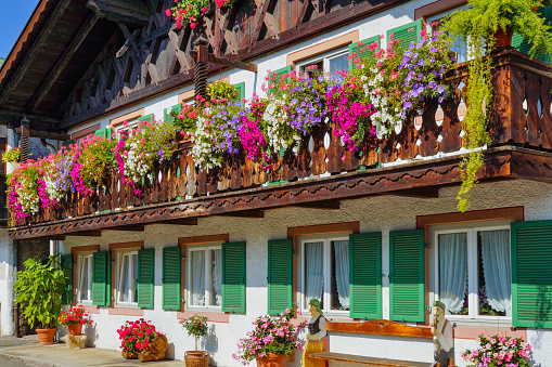 Balcony Flowers on a old House in Garmisch-Partenkirchen, Werdenfels, Bavaria, Germany, Europe