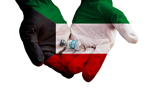 A young woman proudly raises the flag of Mexico above her head against the sky, The other hand holds up her hat, Concept for national holidays and patriotic events