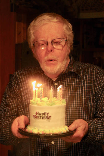 istock Blowing Out Birthday Candles 1309459009
