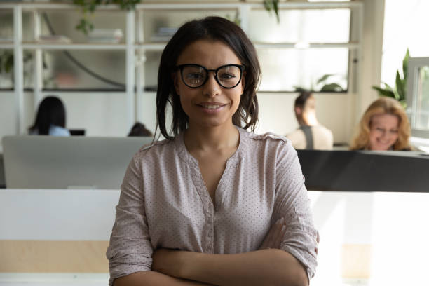 istock Confident biracial female executive looking at camera with happy smile 1309460435