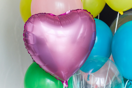 Bunch of colorful helium balloons for birthday or Valentine's day party.