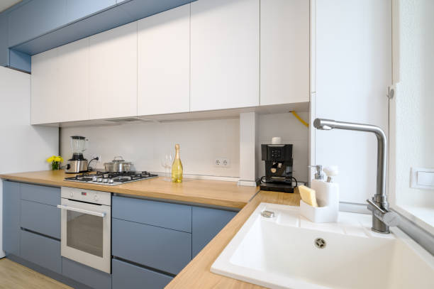 istock Modern blue-teal colored furniture kitchen interior 1309464931