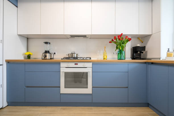 istock Modern blue-teal kitchen interior, furniture front view 1309465059
