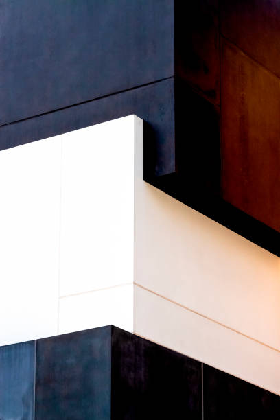 Closeup corner of modern building, abstract background with copy space, vertical composition