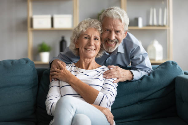 istock Affectionate caring middle aged man cuddling smiling wife. 1309468383