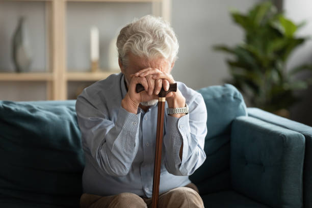 frustrated older disabled hoary man feeling lonely at home. - violence mental illness organized crime crime imagens e fotografias de stock