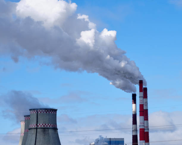 istock Smoke stack against the sky pollutes the air in industrial cities 1309469389