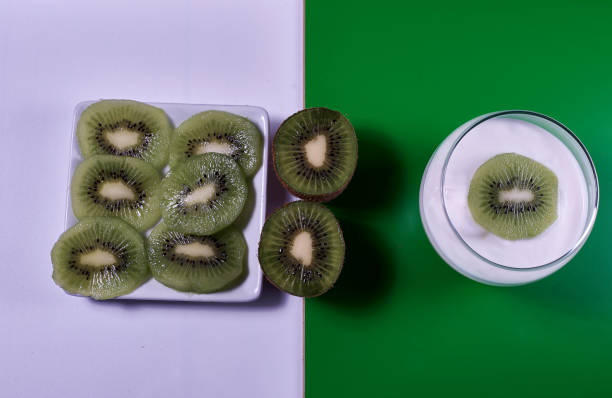 istock Yoghurt glass with kiwi fruit and plate with kiwi 1309469938