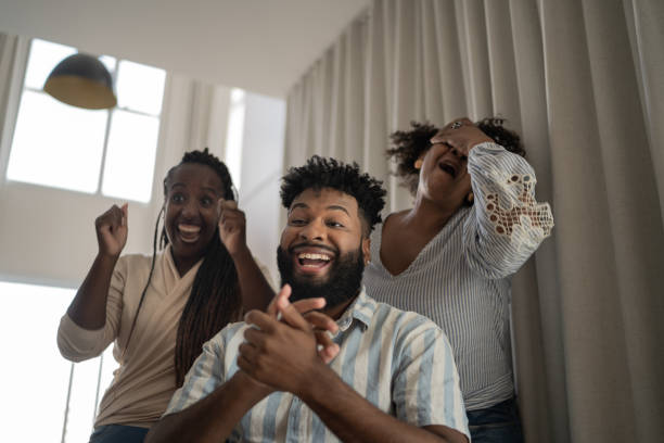 istock Family doing a video call or watching something together at home 1309471765