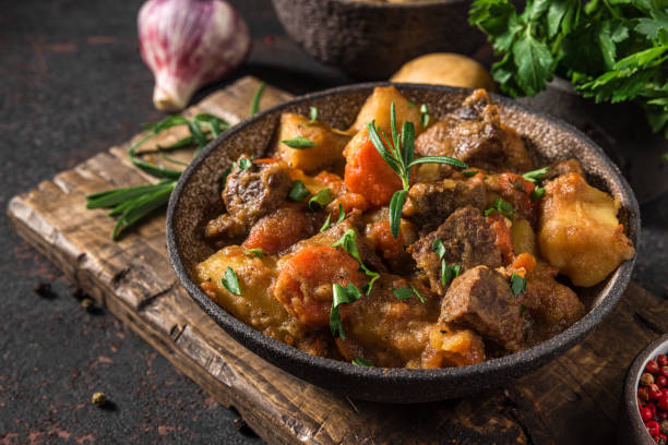 istock Irish stew made with beef, potatoes, carrots and herbs in a plate 1309472386