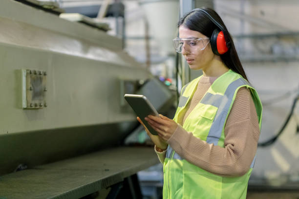 istock Female engineer using digital tablet and working in a factory 1309473604
