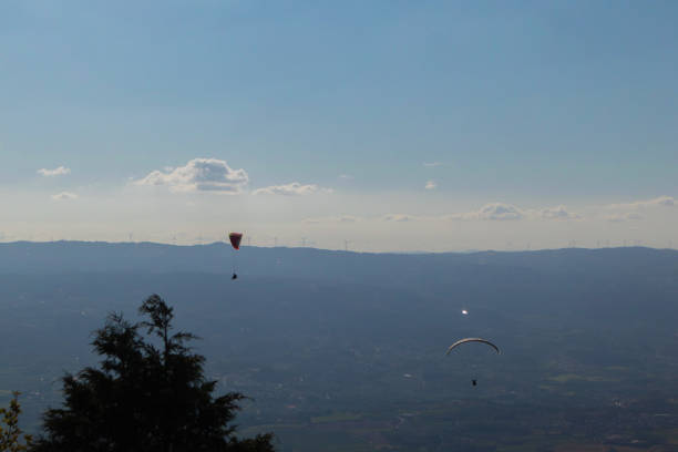 istock Dramatic paragliding duo with beautiful scenery 1309474602