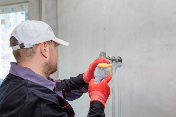 istock An electrician drills holes for sockets with a diamond core bit 1309476518