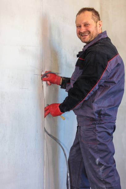 istock An electrician is laying a cable in an electrical wiring ditch 1309476548