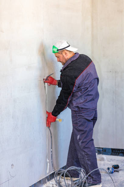 istock An electrician is laying a cable in an electrical wiring ditch 1309476563