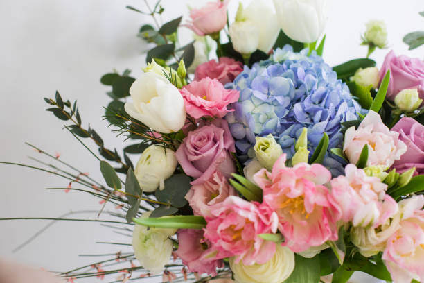 Flower bouquet with blue hydrangea and pink tulips