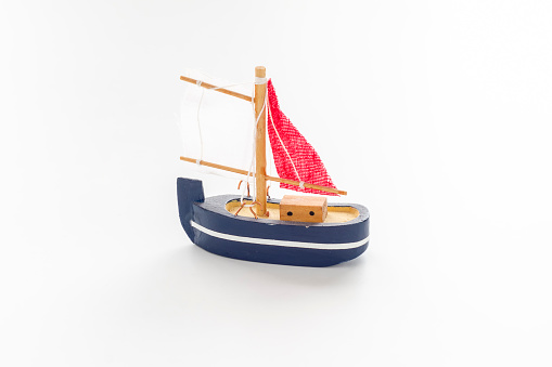 Toy yacht on a white background