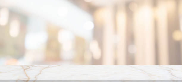 istock marble table top with blurred abstract cafe restaurant interior background 1309489492