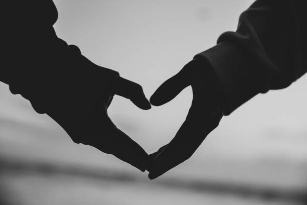 istock Two hands show the shape of the heart 1309491838