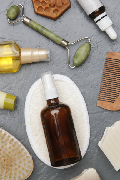 istock Various toiletries on textured gray background, top view 1309495099