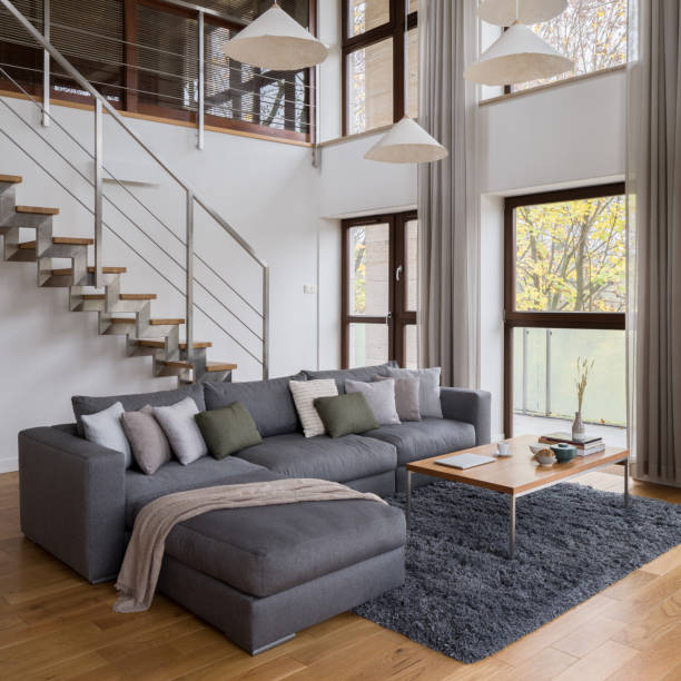 istock Comfortable sofa in living room with stairs 1309495128