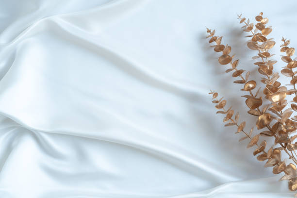 istock Gold tropical palm leaves Monstera on white background. Flat lay 1309495409