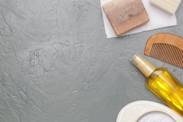 istock Various toiletries on textured gray background, top view 1309496146