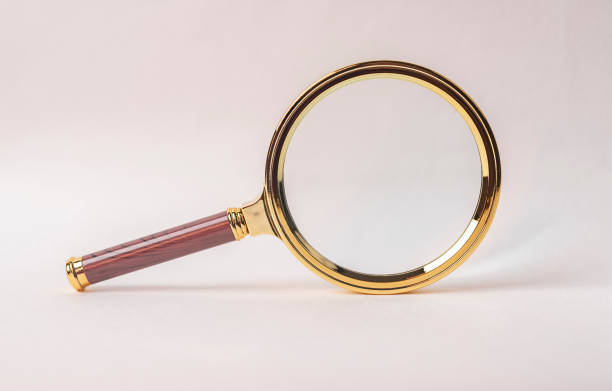 istock Magnifying glass on whit ebackground. Concept of research and education 1309498787