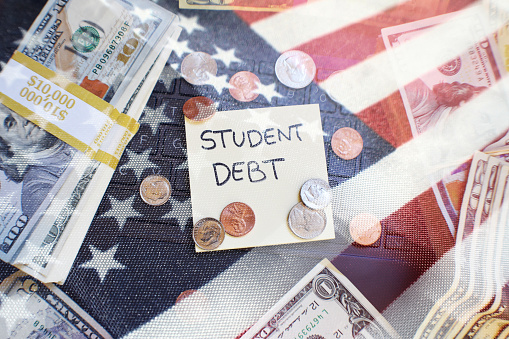 Student Debt Concept In The United States With Borrowed Money With The American Flag