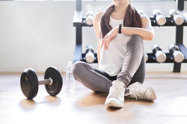 istock Asian woman taking a break in the training gym 1309511067