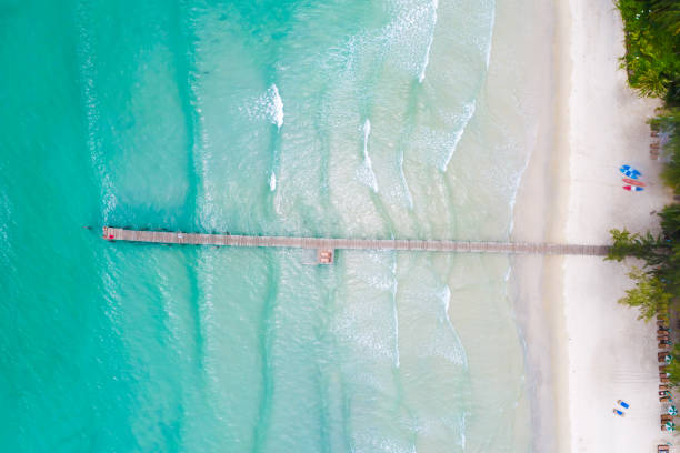 istock Clear sea water on sand beach 1309513491