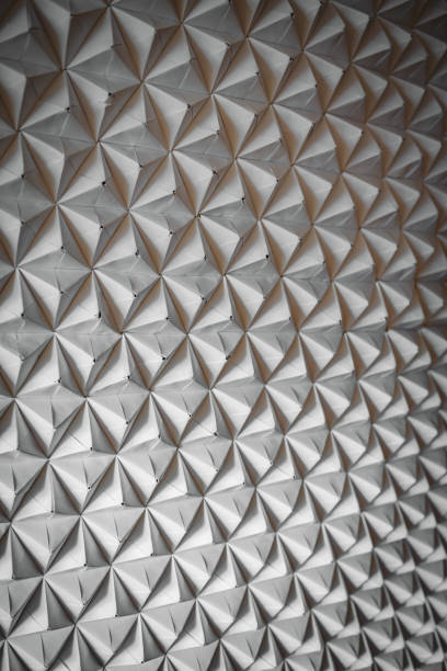 istock paper triangulated background with interesting backlighting. 1309514550