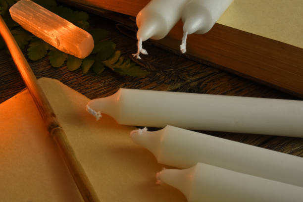 istock Blank paper, magic wand, and magic candles 1309516000