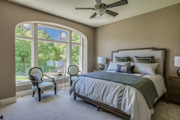 Huge windows for amazing view from bedroom Ceiling fan and sitting area for extra comfort while relaxing in master bedroom owner's bedroom stock pictures, royalty-free photos & images