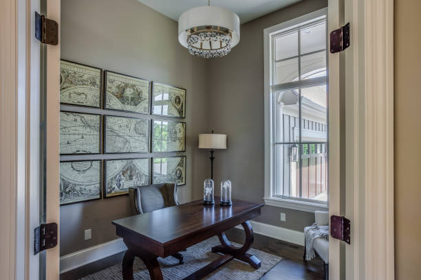 istock Stylish home office with world map on the wall 1309517095