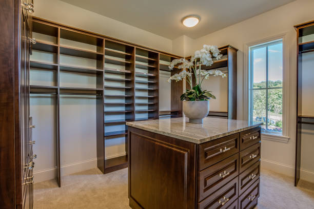 istock Walk in closet with island dresser 1309517096