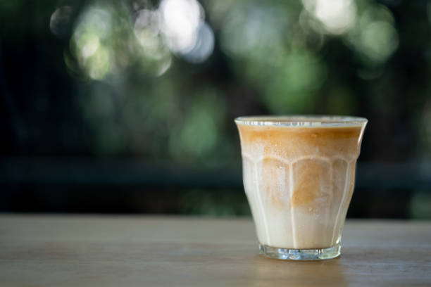 istock Dirty coffee on the wooden table, close up 1309521197