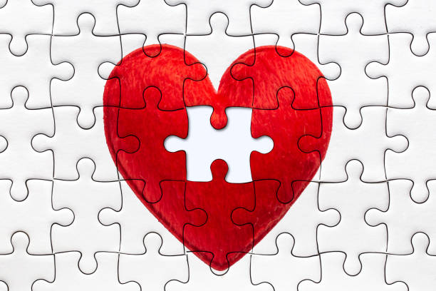 istock Red Love Heart Puzzle Complete with Last Piece for Someone concept. 1309522778