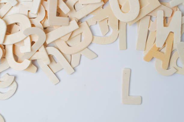 istock ABC english wood letters on white blackground 1309525304
