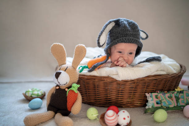 istock Cute baby bunny in the basket 1309525512